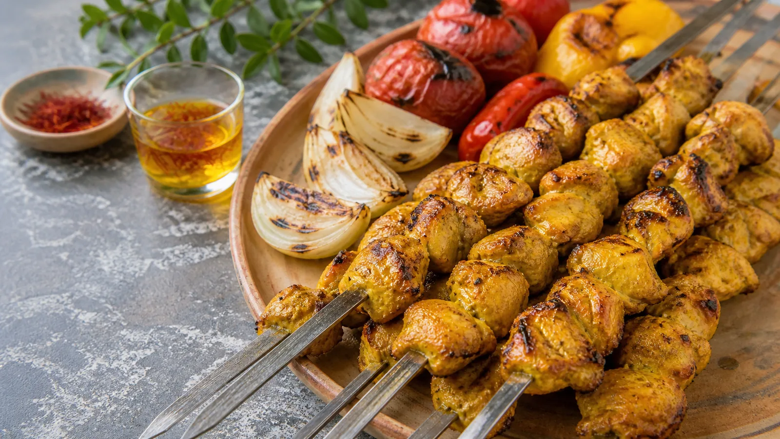 Lari kebab chicken with saffron yogurt marinade on charcoal skewers