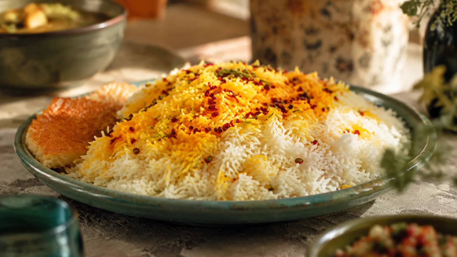 Fluffy Persian saffron rice with golden grains and barberries