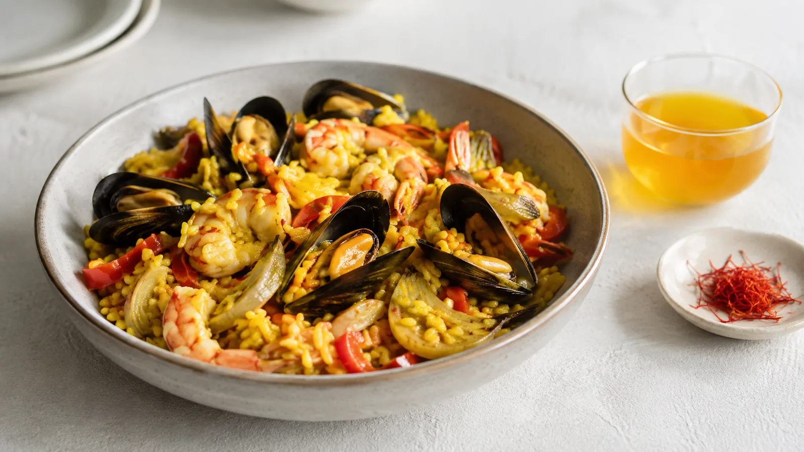 Golden saffron seafood rice with broth and saffron threads